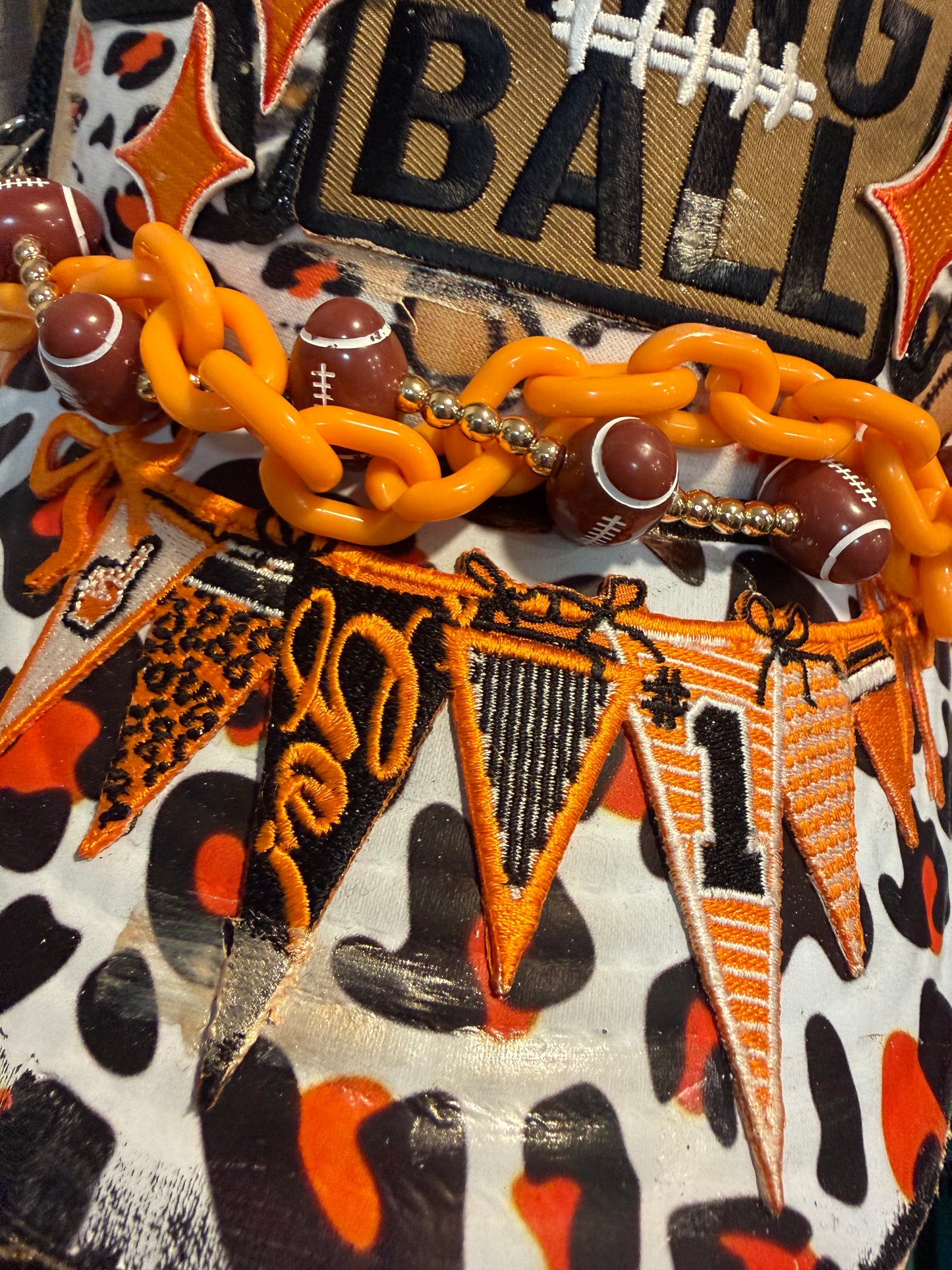 Blu Coconut Black, White and Orange Banner Football Trucker Hat.