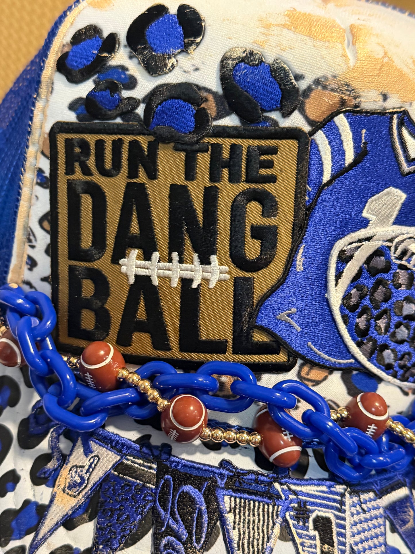 Blu Coconut run the dang ball football trucker hat.