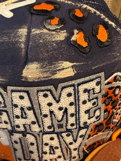 Blue Coconut navy and orange bow football Trucker Hat 🧡💙