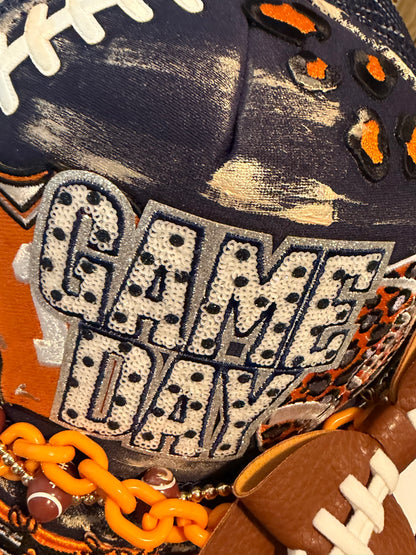 Blue Coconut navy and orange bow football Trucker Hat 🧡💙