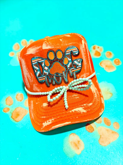 Blu Coconut orange and turquoise dog mom trucker hat