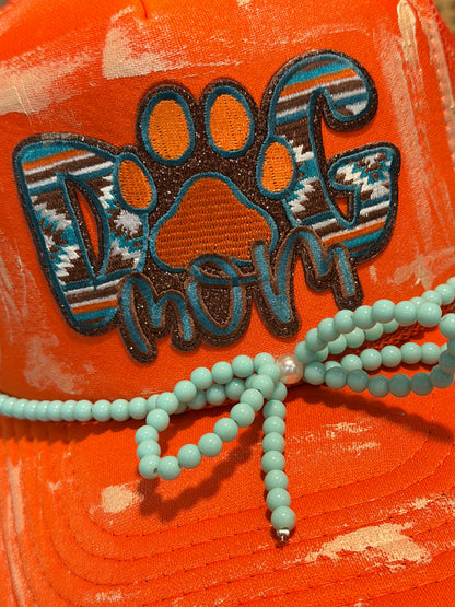 Blu Coconut orange and turquoise dog mom trucker hat
