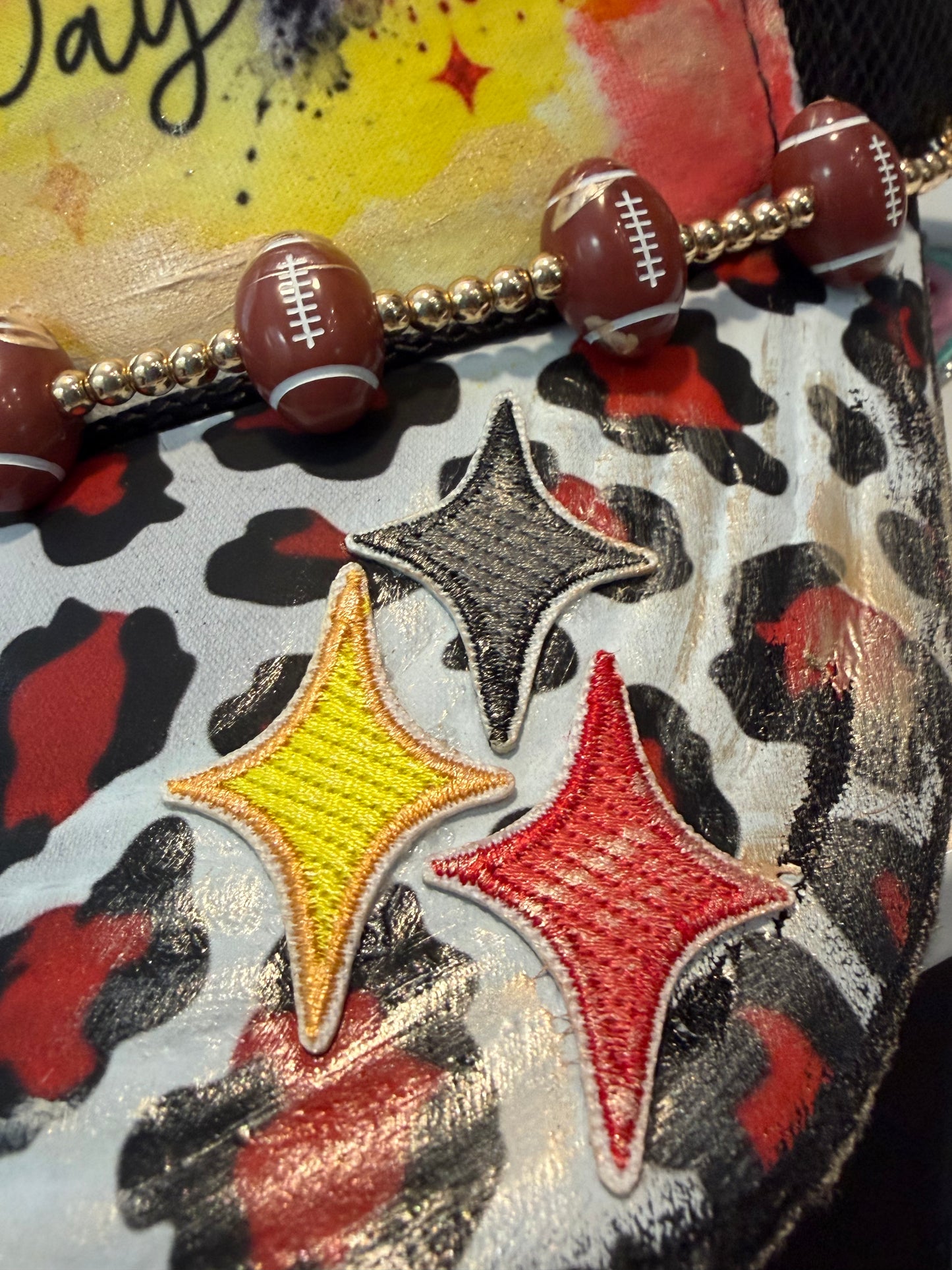 Blu Coconut Black, yellow and red football Trucker Hat