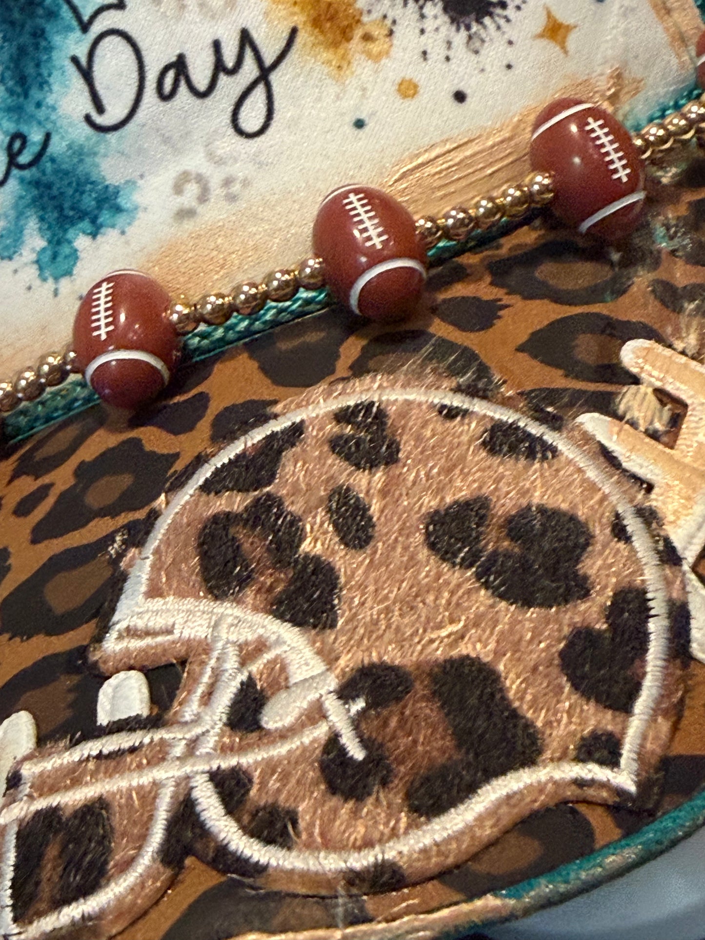 Blu Coconut Teal Leopard football Trucker
