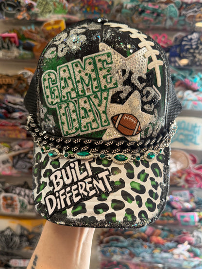 Blu Coconut Black and Green Football Trucker Hat. 💚🖤🏈
