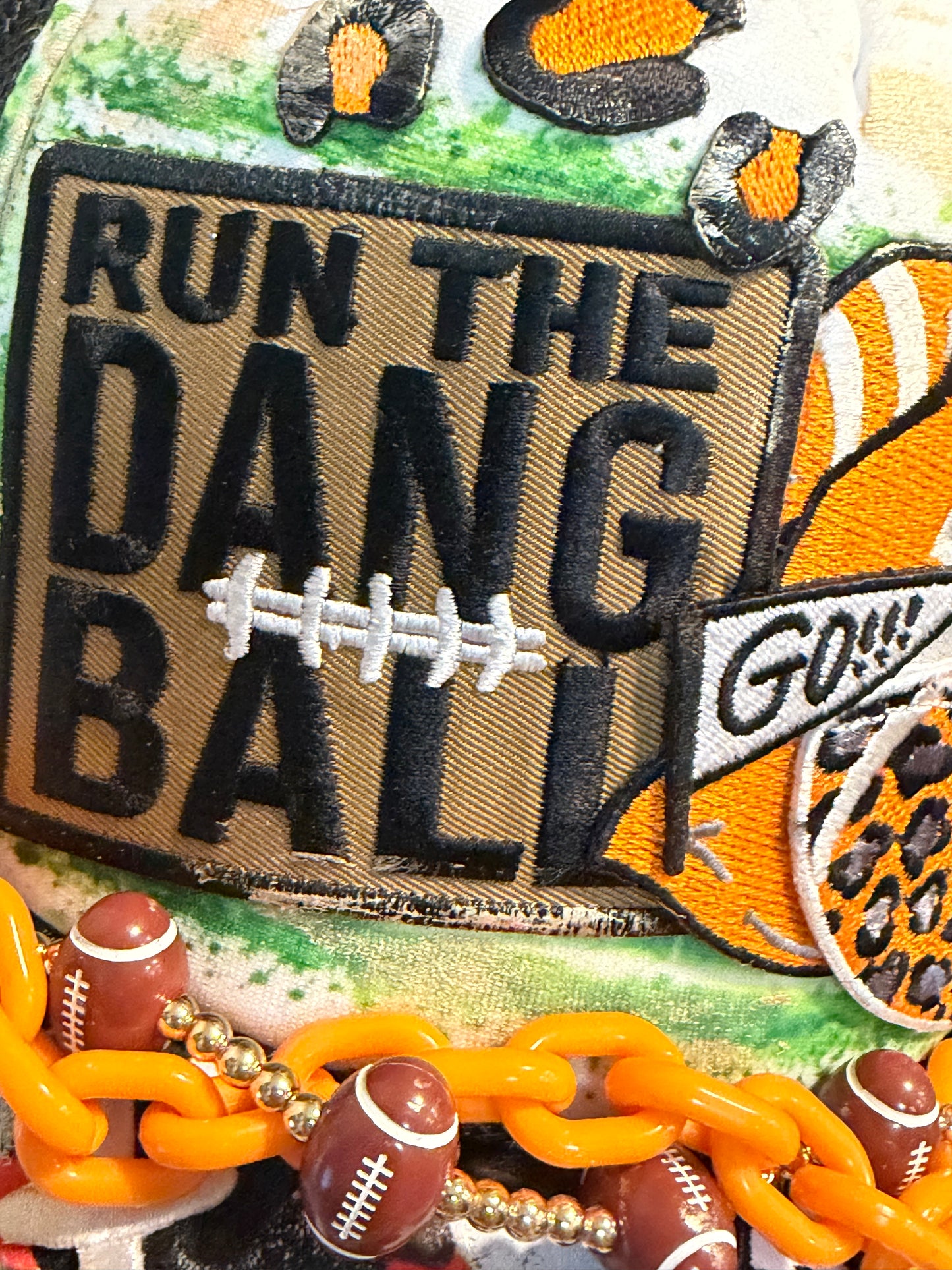 Blu Coconut black white and orange football trucker hat.