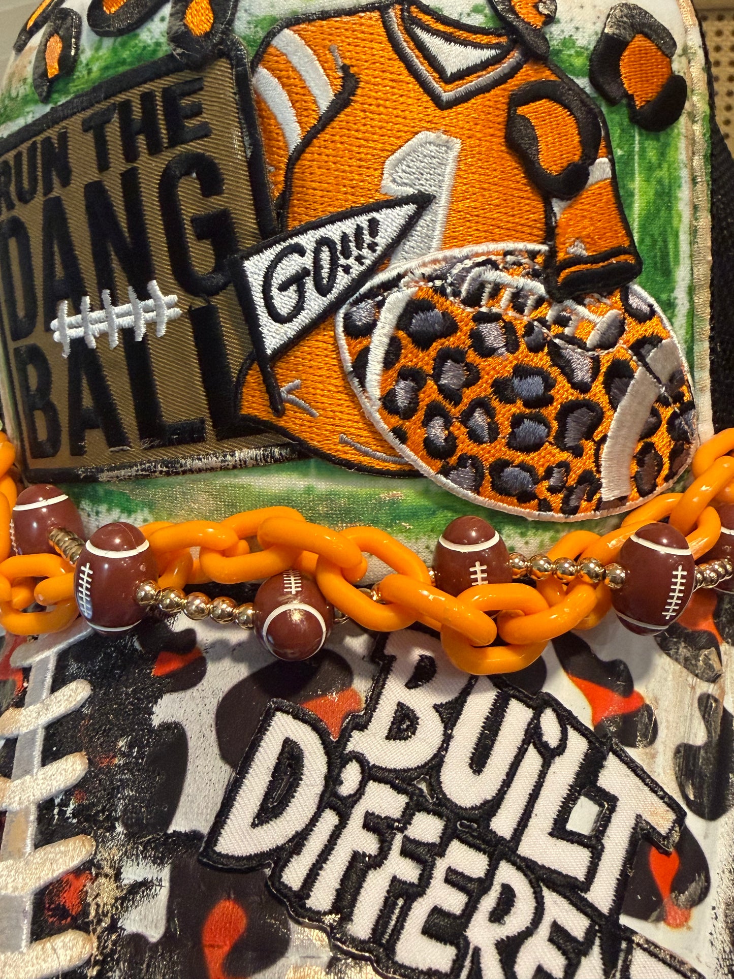 Blu Coconut black white and orange football trucker hat.