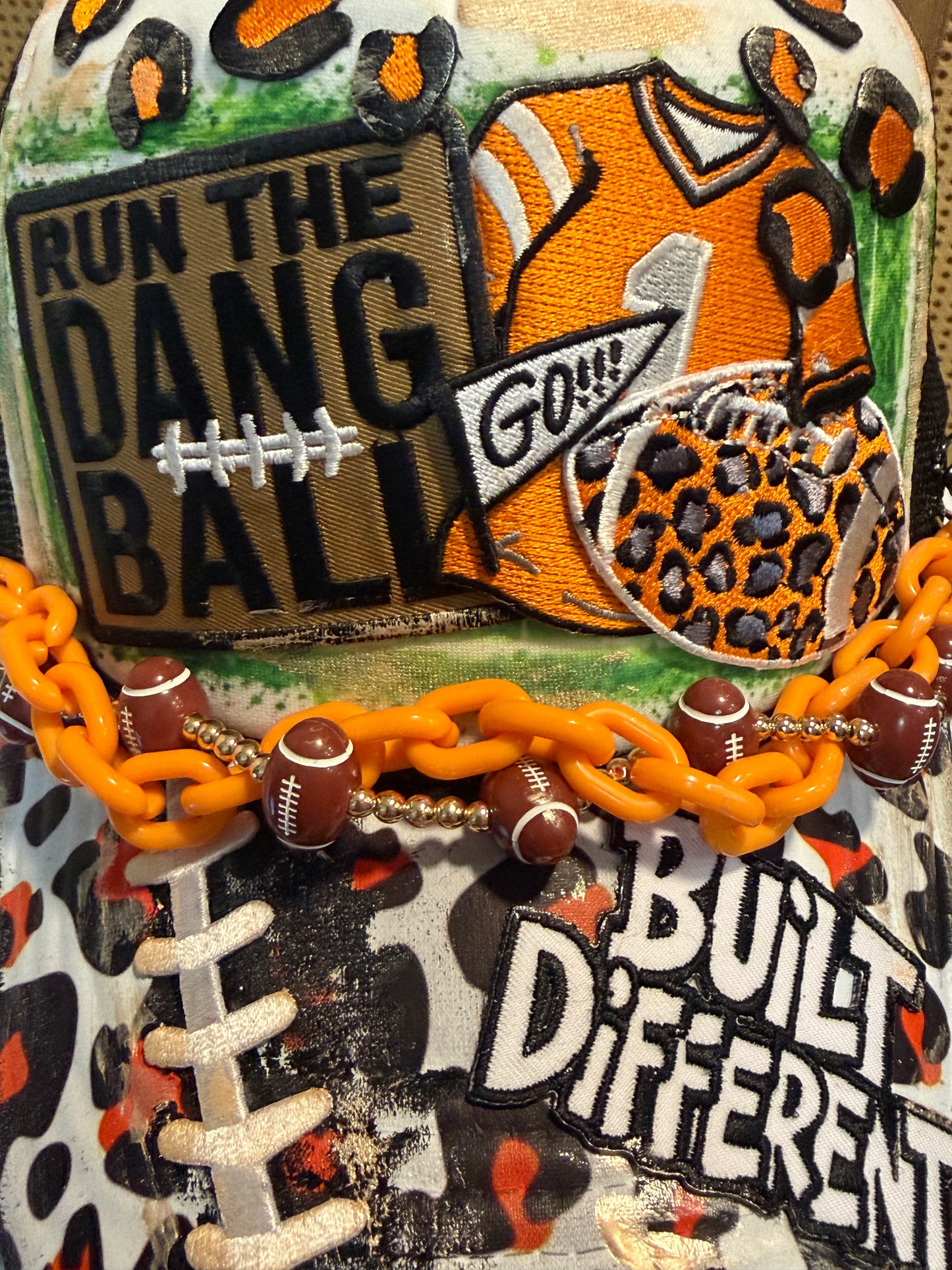 Blu Coconut black white and orange football trucker hat.
