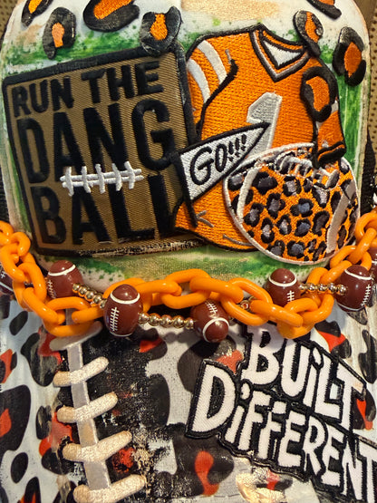 Blu Coconut black white and orange football trucker hat.