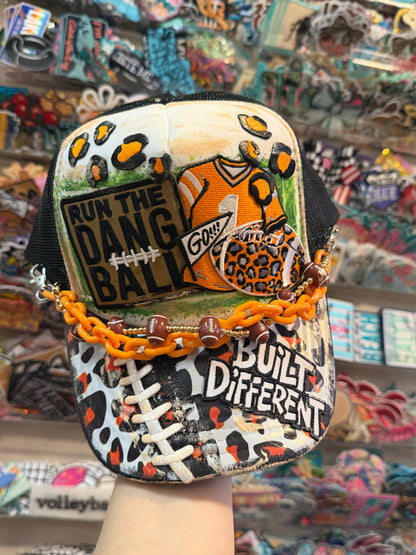 Blu Coconut black white and orange football trucker hat.