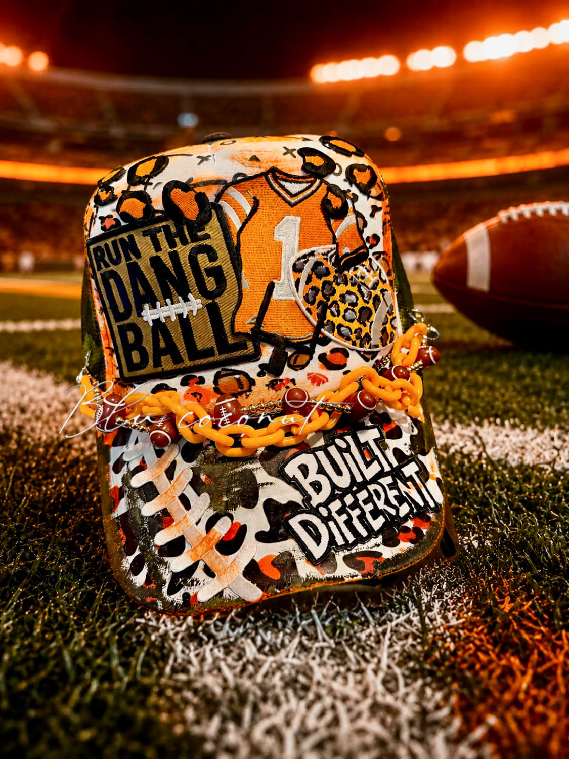 Blu Coconut Camo, white and orange run the dang ball trucker hat