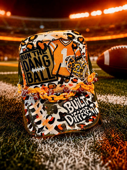 Blu Coconut Camo, white and orange run the dang ball trucker hat