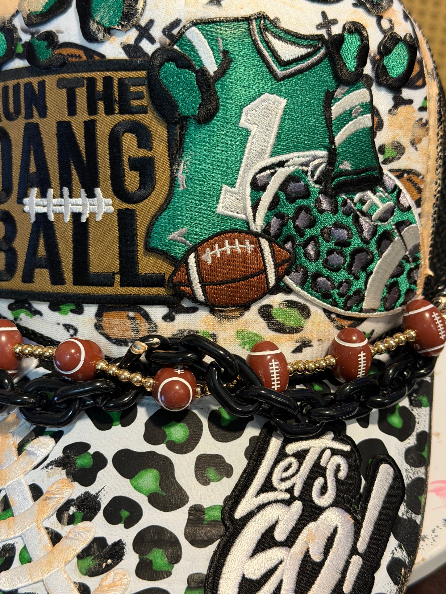 Blu Coconut Black, white and green football trucker hat