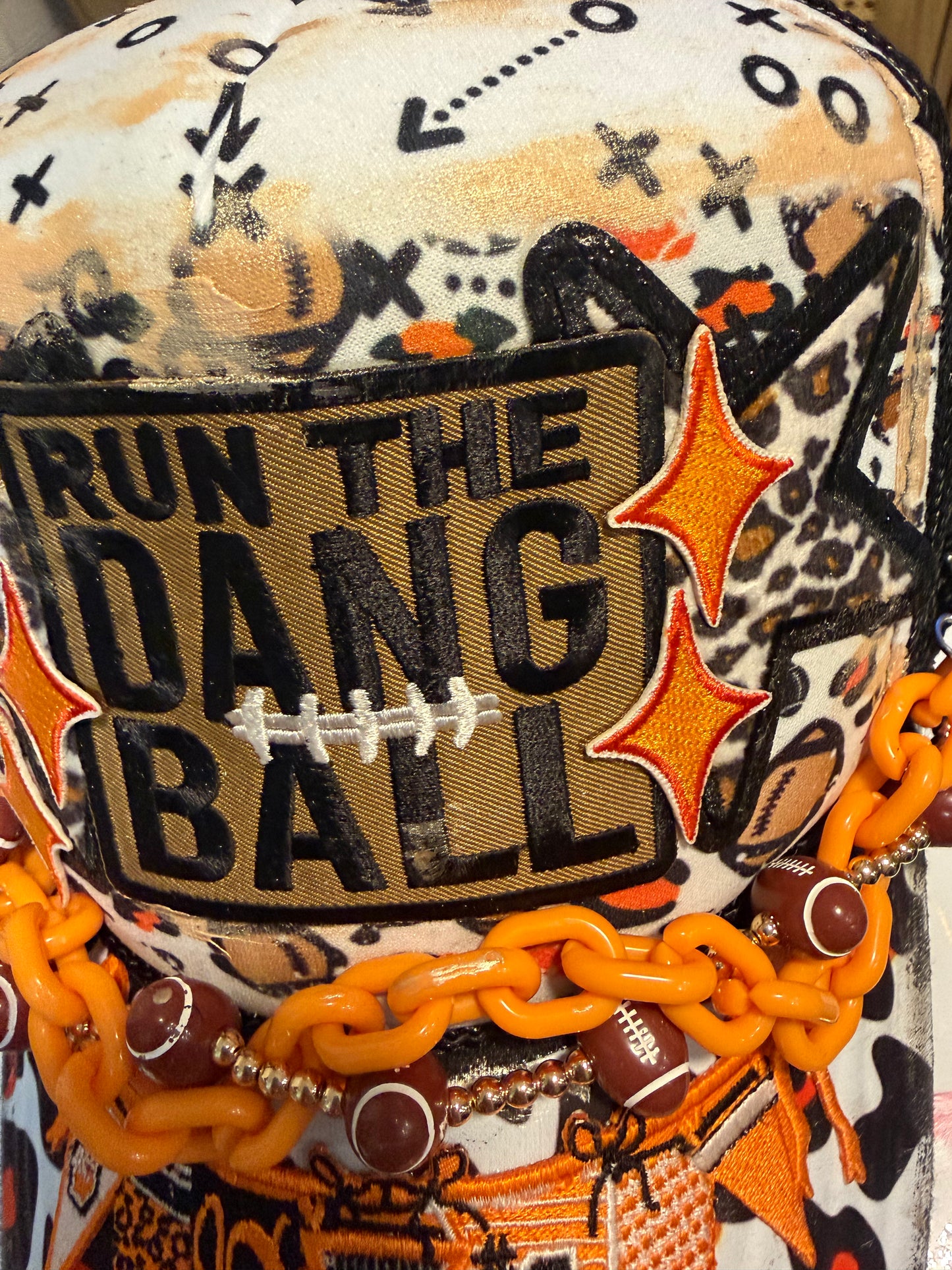 Blu Coconut Black, White and Orange Banner Football Trucker Hat.