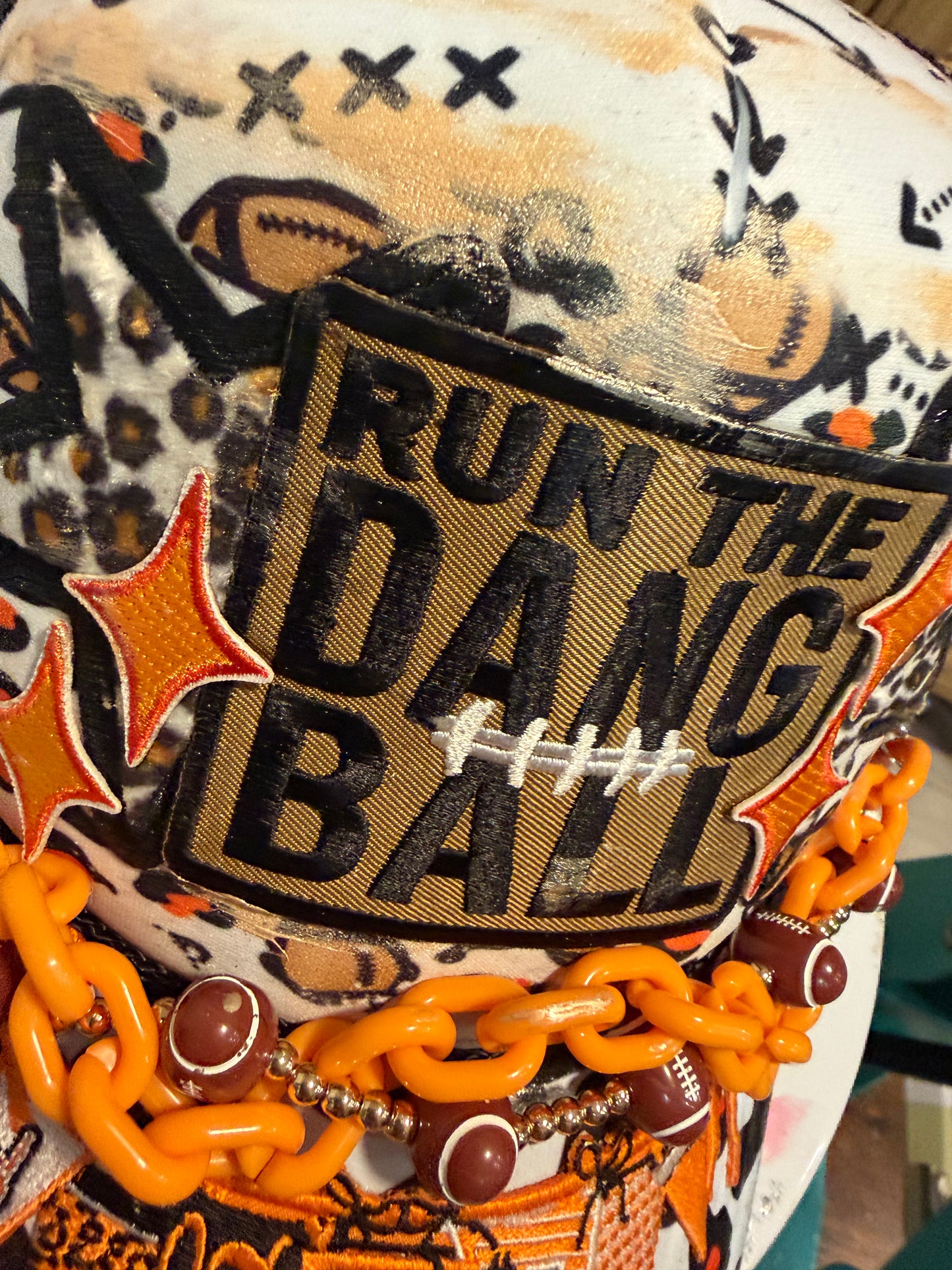 Blu Coconut Black, White and Orange Banner Football Trucker Hat.