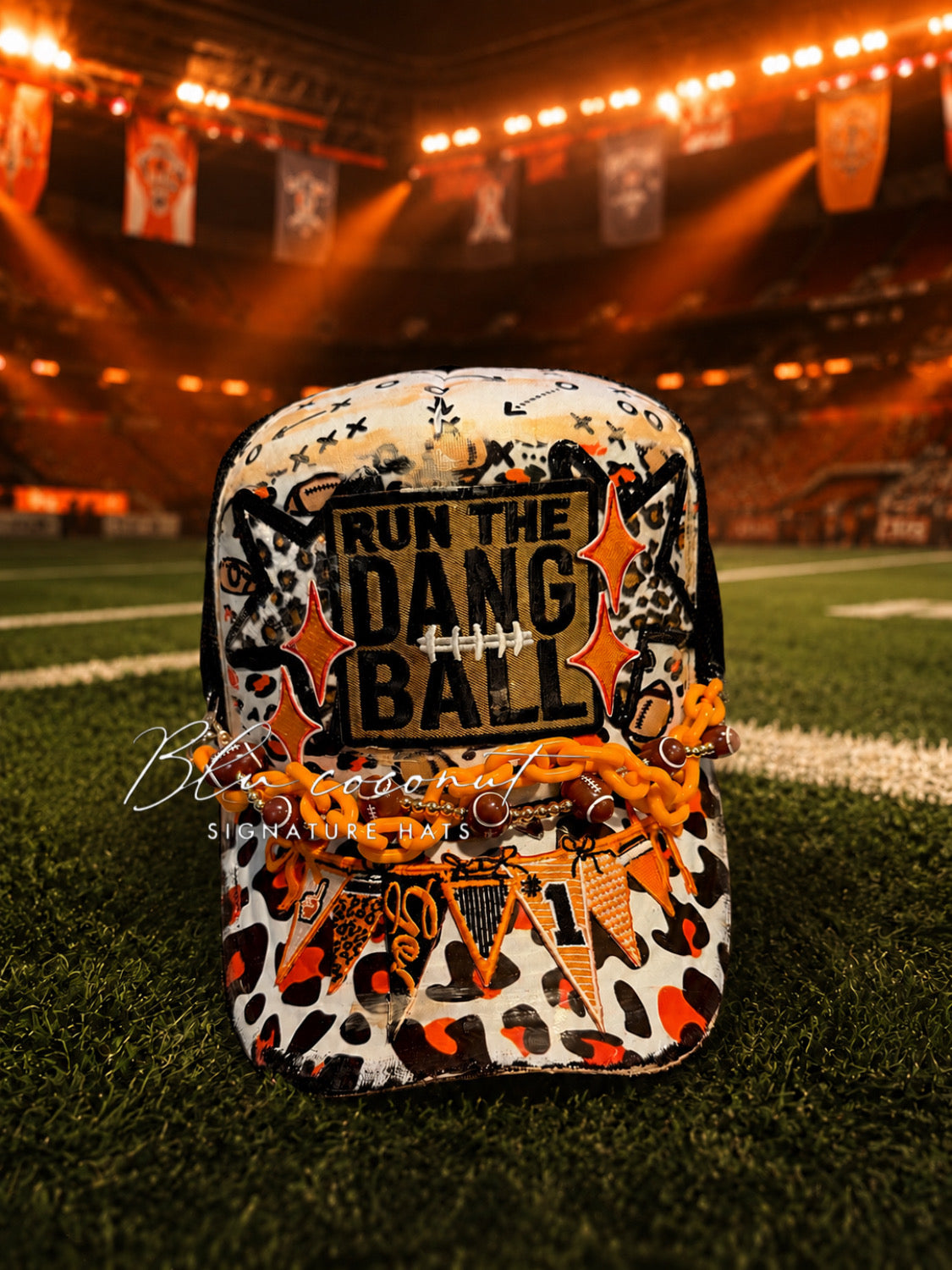Blu Coconut Black, White and Orange Banner Football Trucker Hat.