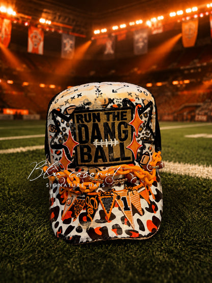 Blu Coconut Black, White and Orange Banner Football Trucker Hat.