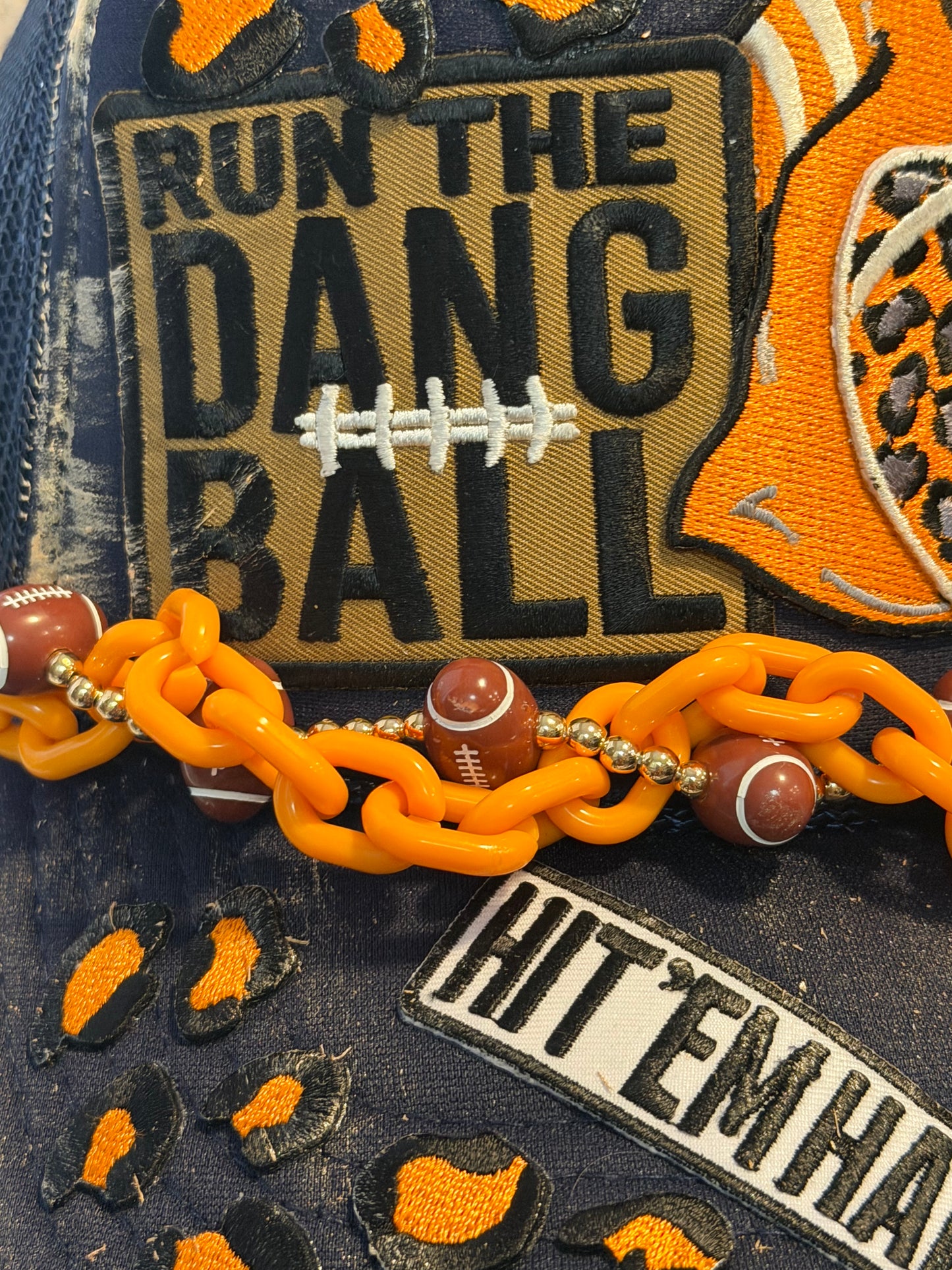 Blu coconut navy and orange football trucker