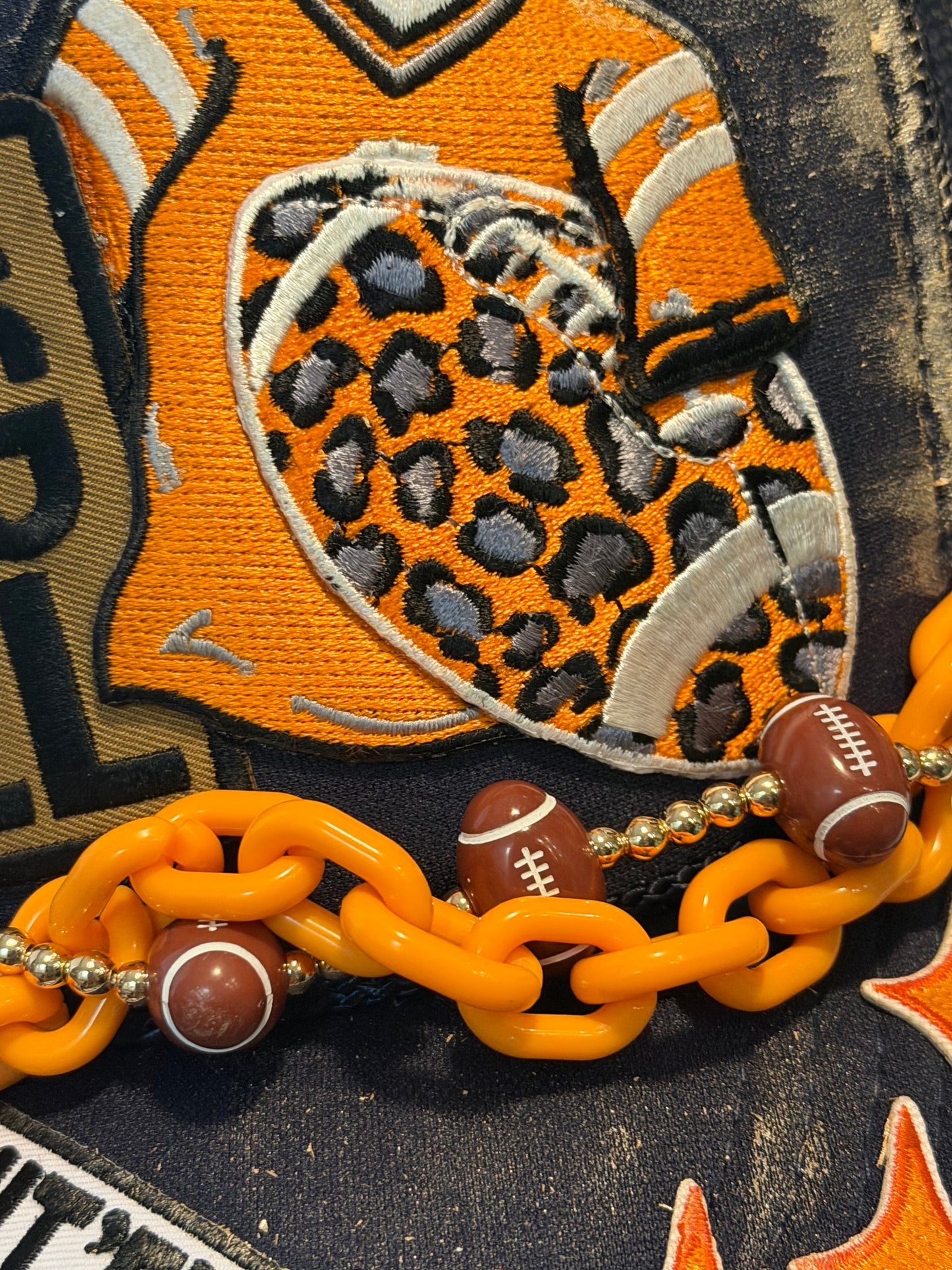 Blu coconut navy and orange football trucker