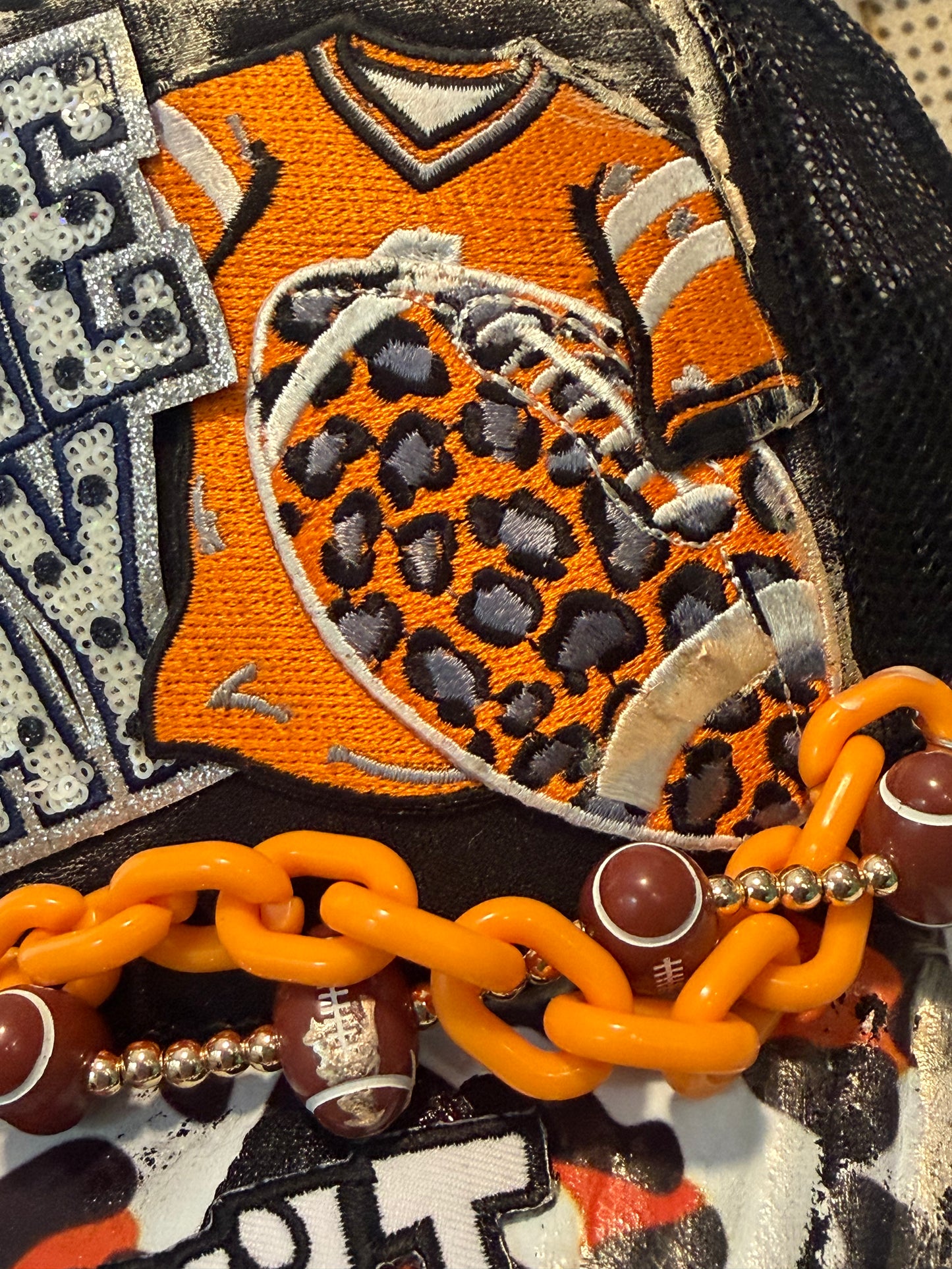 Blu Coconut black and orange football Trucker hat