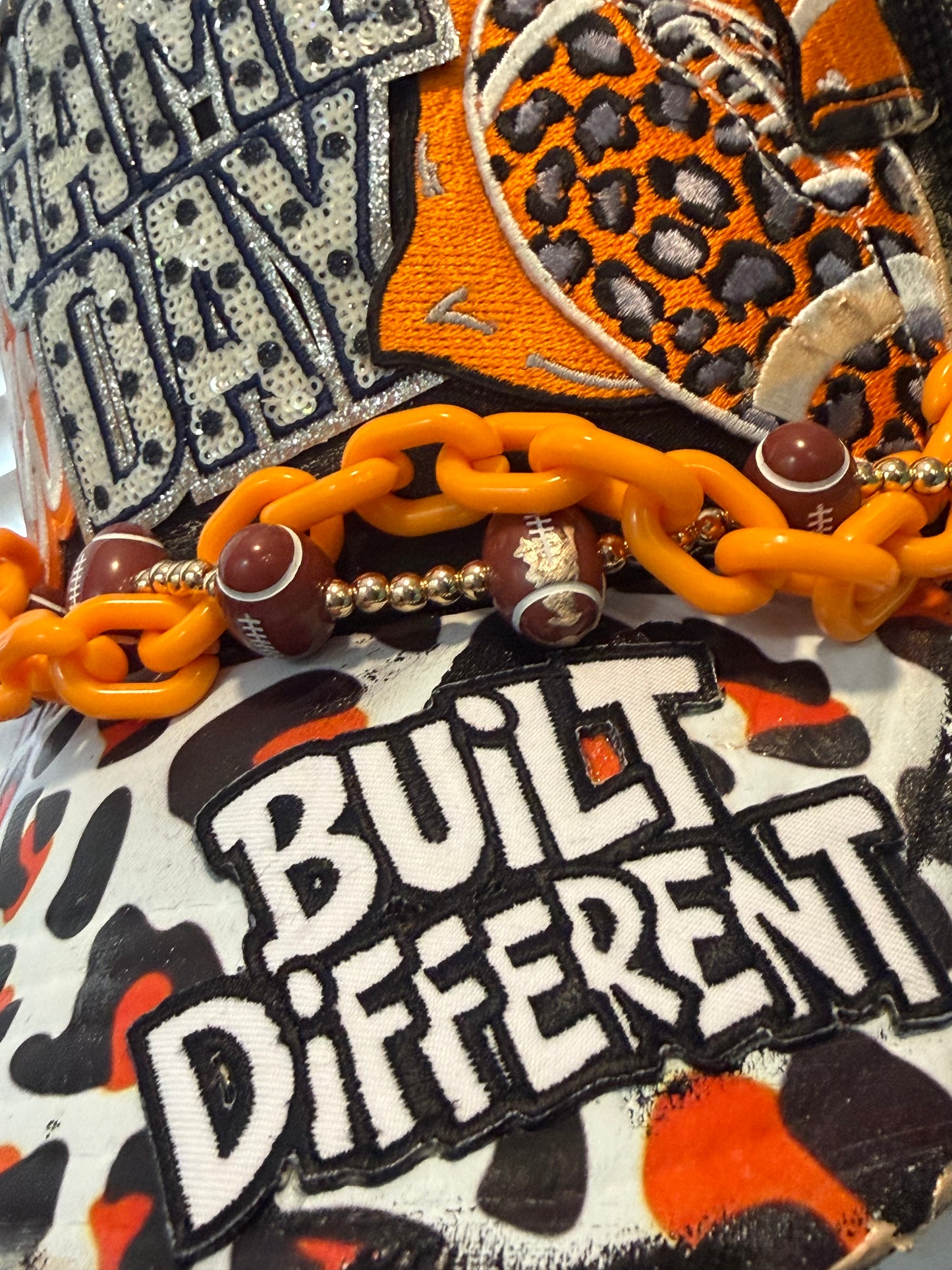 Blu Coconut black and orange football Trucker hat