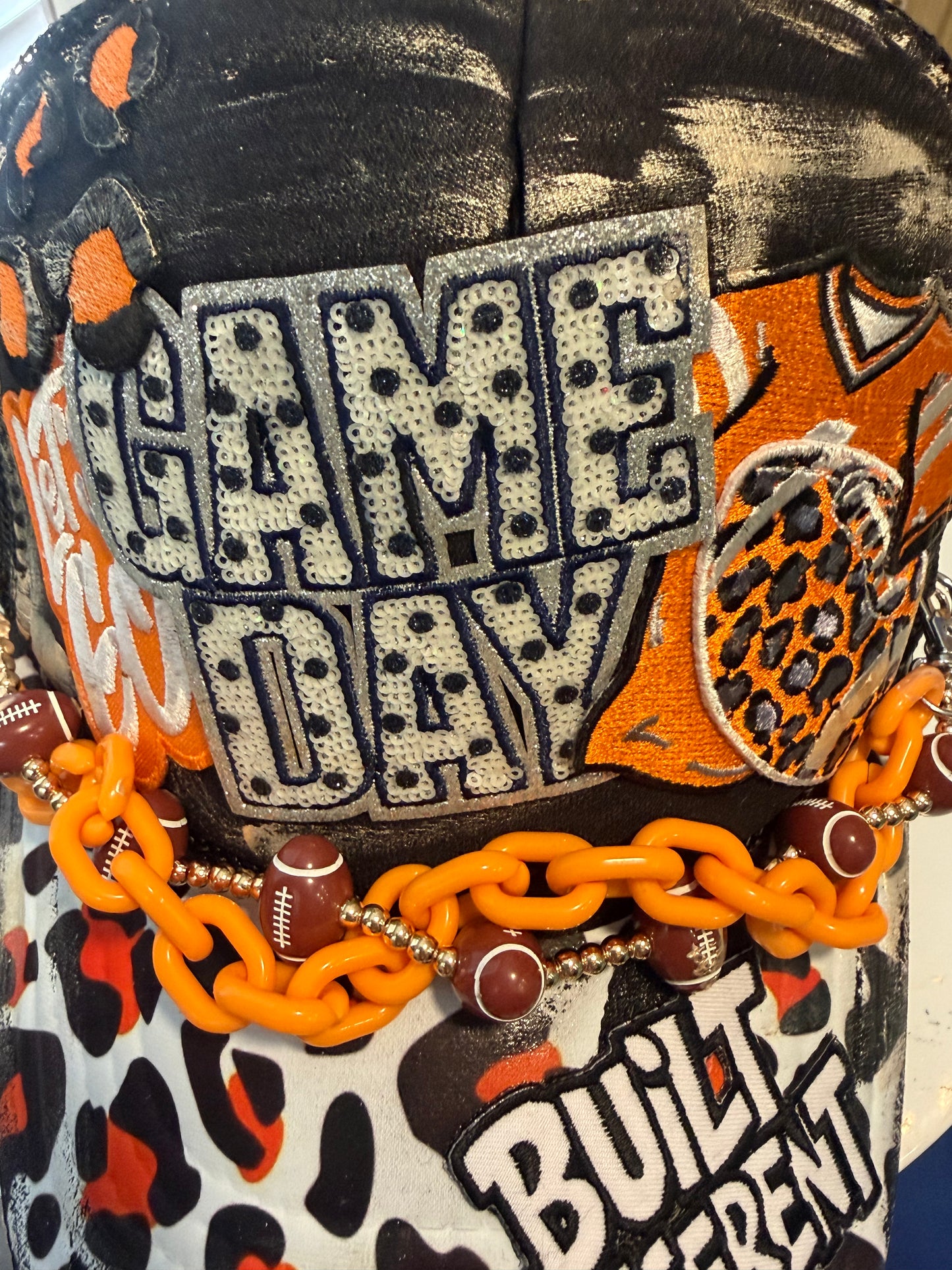 Blu Coconut black and orange football Trucker hat
