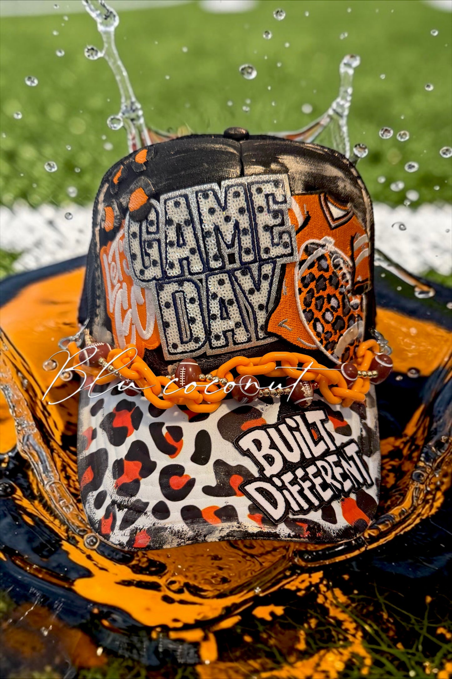 Blu Coconut black and orange football Trucker hat
