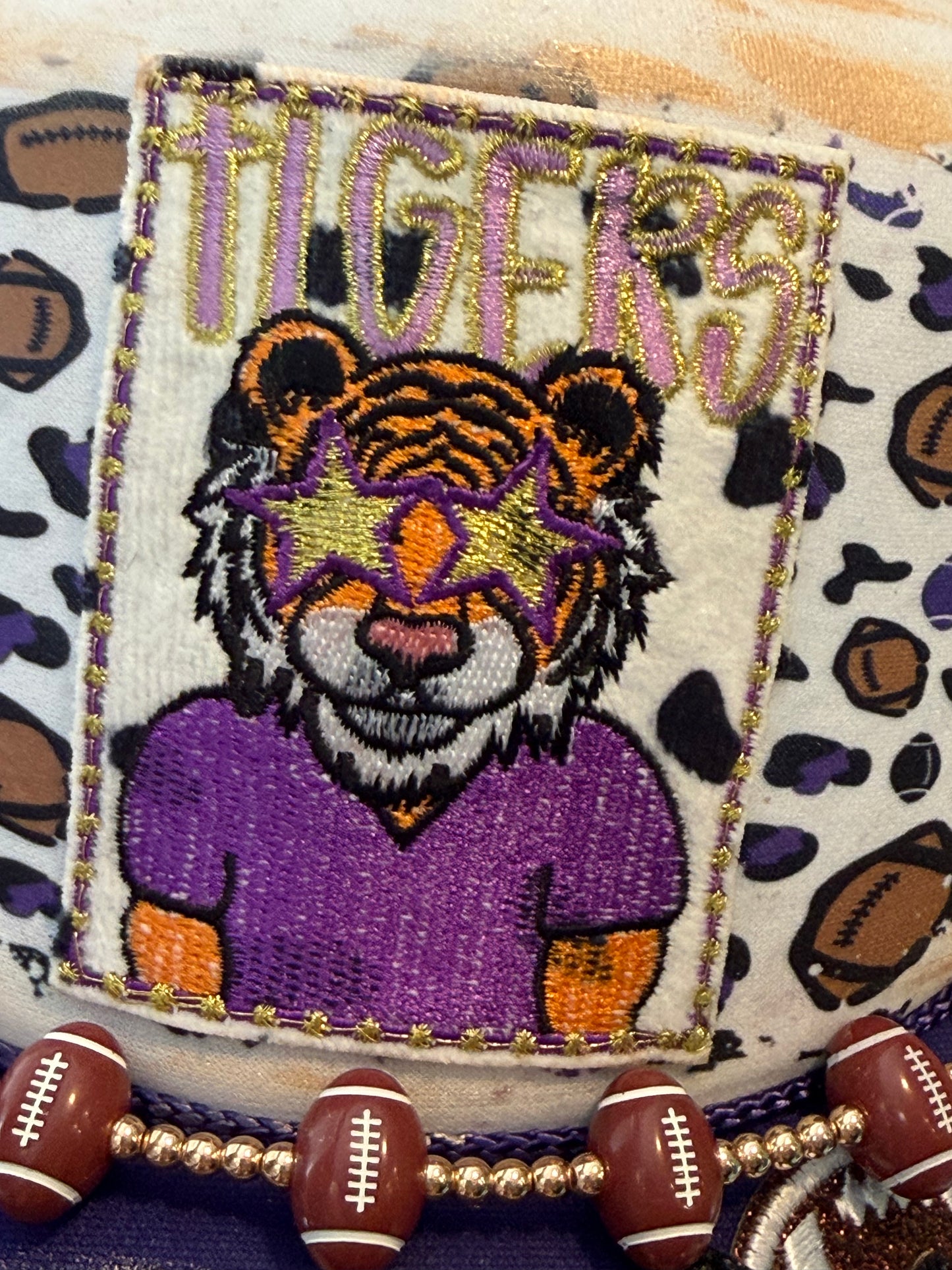 Purple tigers football trucker hat