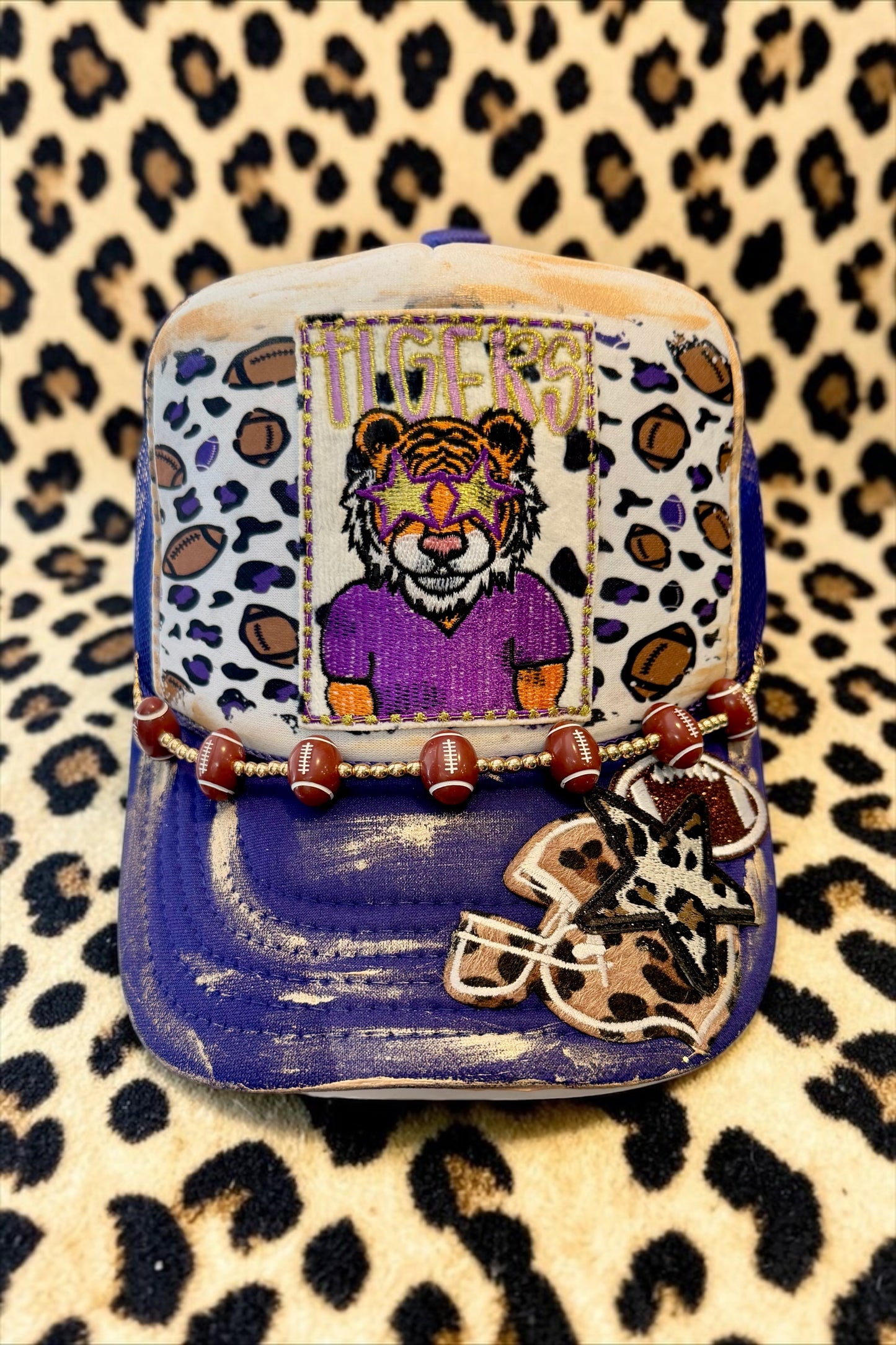 Purple tigers football trucker hat