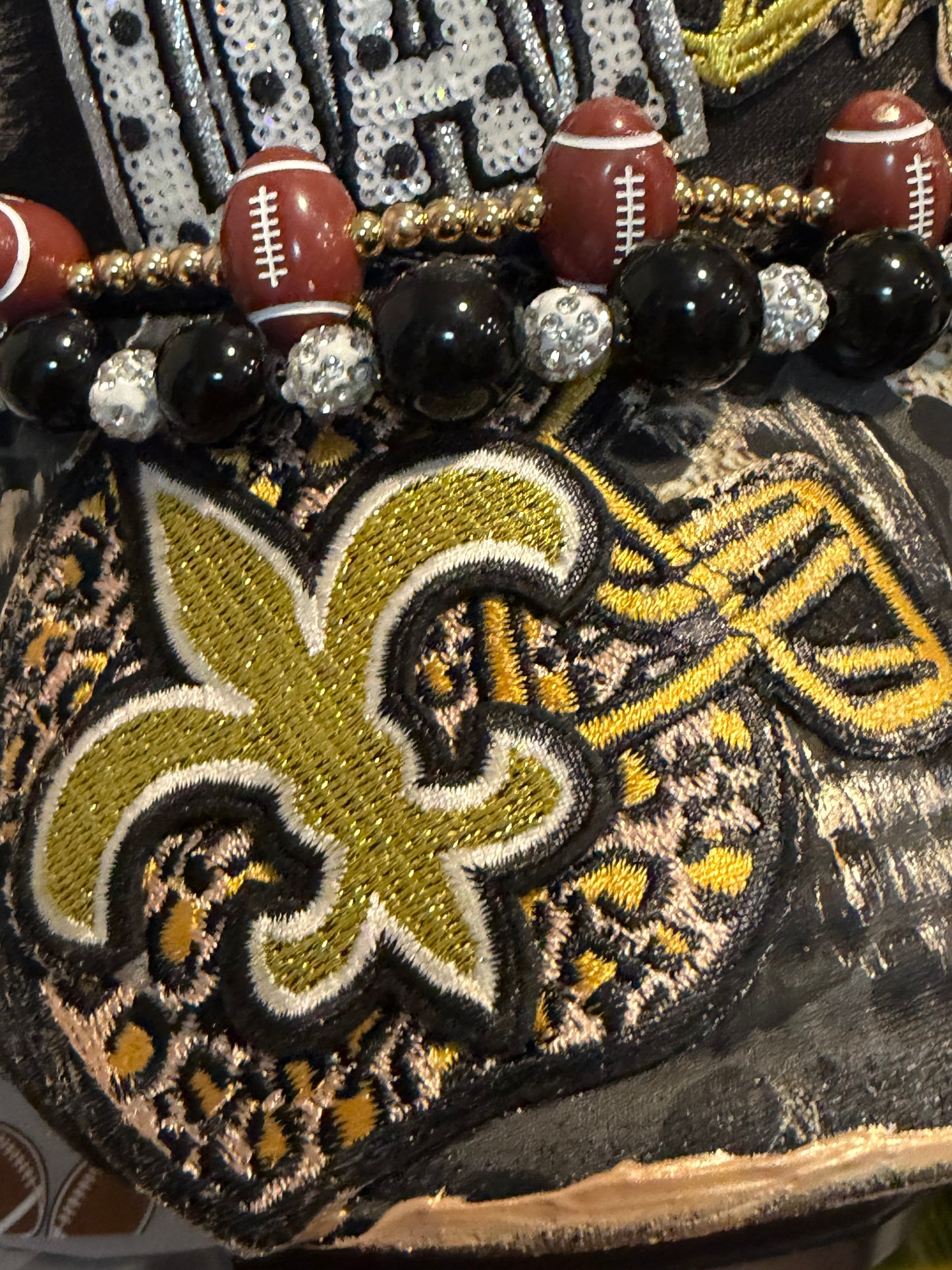 Black and gold leopard game day trucker hat