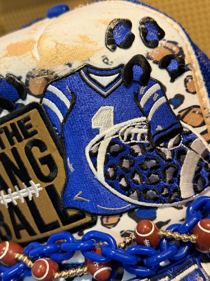 Blu Coconut run the dang ball football trucker hat.